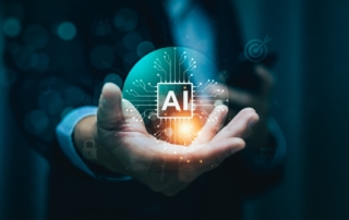 AI Cybersecurity Automation Tools. A close-up of a hand holding a glowing green-blue orb labeled "AI." The orb appears holographic, with circuitry patterns and icons (like a target, padlock, and cloud) surrounding it, implying futuristic technology or AI integration.
