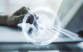 Sodinokibi ransomware infection steps. The image shows a person’s hand typing on a keyboard in a blurred, soft-focus background. Overlaid on top of the image is a translucent, digital padlock symbol, representing cybersecurity or data protection. The padlock has a futuristic, circuit-like design and is surrounded by concentric circles and floating binary numbers (ones and zeros), further emphasizing a tech or cybersecurity theme. The overall color scheme is a mix of muted whites, grays, and light blues, giving the image a modern, clean, and secure feel. The focus on the hand and the digital padlock suggests the importance of secure online activity or protection of sensitive information.