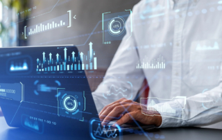 Cyber breach recovery timeline. The image shows a person working on a laptop with a digital overlay of data visualizations and charts. The person, dressed in a white shirt, is using the keyboard, and their focus appears to be on the screen. Overlaid on the image are various data elements, including bar graphs, line charts, percentage indicators, and circular progress graphics, all representing analytics or data monitoring. The background is slightly blurred, emphasizing the digital data elements, which give the scene a futuristic, high-tech feel, as if the individual is analyzing real-time information or working in data science, cybersecurity, or business analytics.