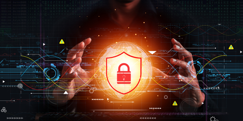 Cross-industry ransomware solutions. A person’s hands frame a glowing orange shield with a padlock, surrounded by digital lines and symbols, symbolizing secure data.