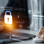 On-premises vs. cloud recovery solutions. A person in formal business attire is working on a laptop while using a mouse. A holographic overlay appears in front of the screen, featuring a large glowing padlock symbol, representing cybersecurity and data protection. Surrounding the lock are various digital interface elements, including security ratings, authentication fields, and shield icons, suggesting encryption, secure access, and compliance. The lighting and reflections give the image a futuristic, tech-driven feel.