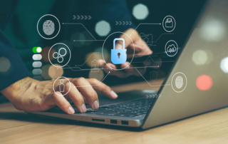 Post-attack cybersecurity roadmap. A person is typing on a laptop in a dimly lit environment, with a glowing digital security interface overlaying the screen. The icons displayed include a padlock, a user profile, and gears, representing cybersecurity, access control, and system optimization.