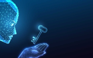 Automated Patch Management. A digital-style blue graphic shows a wireframe human face and hand. A glowing key floats just above the palm, symbolizing access, identity, or cybersecurity. The image is abstract and futuristic in tone.
