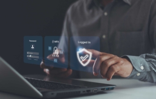 Patch management for ransomware defense. This image shows someone interacting with a holographic interface emerging from a laptop. They touch virtual screens displaying icons indicating password entry, multi-factor authentication (MFA), and a shield icon confirming successful login. The person is in professional attire, reinforcing the concept of secure digital identity verification and cybersecurity.