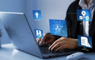 Ransomware preparedness audits. A person dressed professionally is sitting at a laptop, typing on the keyboard. Around the laptop, there are virtual icons floating in the air, labeled with things such as problem-solving (a lightbulb icon), decision-making (gear icons with check and cross marks), and risk assessment (represented by a notepad icon). This image highlights a person engaged in analytical or cybersecurity-related work, emphasizing thoughtful decision-making.