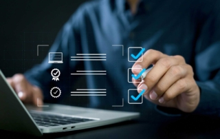 Advanced Email Sandboxing Solutions. A person checks off digital icons on a laptop screen, representing completed tasks or software validations in a checklist interface.