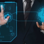 devsecops-ransomware-integration DevSecOps ransomware integration. A person in a business suit holding a glowing holographic globe connected to a transparent futuristic display panel with various icons and data visuals.