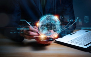 Email Threat Prevention for Compliance. A person in a suit holds a smartphone, with a holographic globe and digital data streams connecting to a nearby laptop.