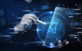 VDI ransomware security. A hand holding a stylus interacts with a glowing digital sphere representing Earth, surrounded by blue holographic icons and the large letters “AI.” The background shows faint futuristic graphics.